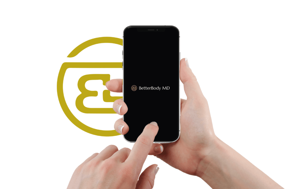 Hands holding a phone that is showing Better Body MD on the screen.