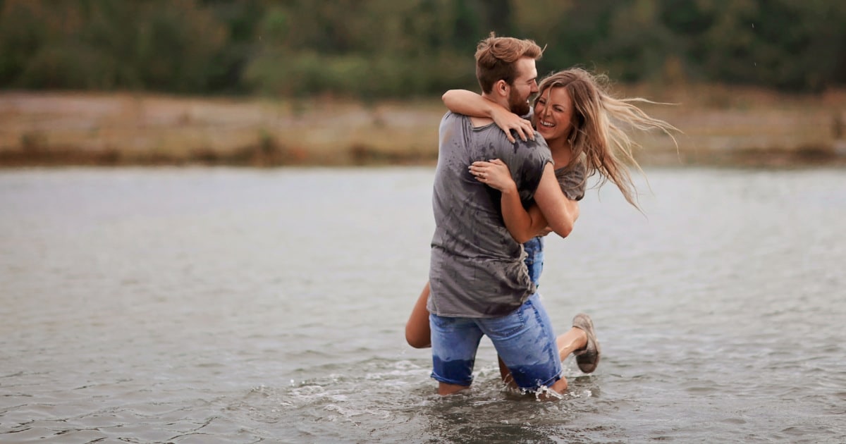 a cute pair cuddling in the water