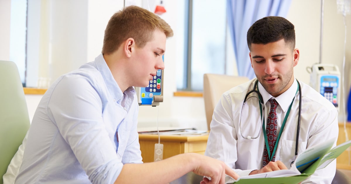 a man talking to a doctor